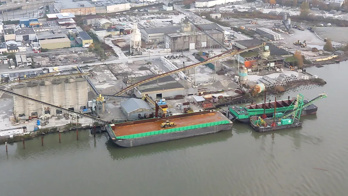 Aerial view of industrial land beside the Fraser River